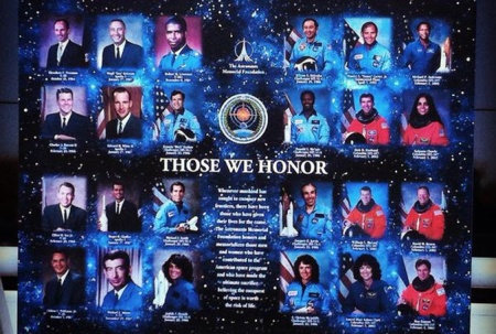 Fallen astronauts and NASA personnel are pictured on a board displayed in front of the Space Mirror Memorial, Wednesday, Jan. 28, 2015, during NASA's Day of Remembrance. (PHOTO/Jon Shaban, Staff)